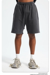 Detailed close-up of dark grey heavy cotton sweat shorts with adjustable drawstring waist