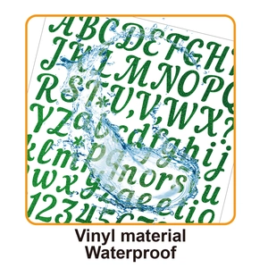 Macro shot of green glitter vinyl alphabet stickers showing waterproof water splash texture