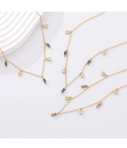 Close-up of geometric S925 silver necklaces with colorful square zircon pendants