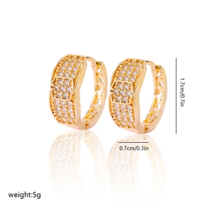 Detail of gold zircon hoop earrings with hexagonal patterns and dimensions marked