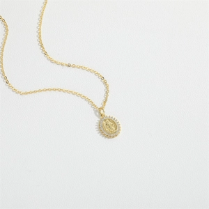 Gold Guanyin necklace with oval religious pendant and sparkling zircon stone edges