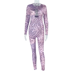 Detail showing purple leopard print fabric on a long sleeve backless bodysuit