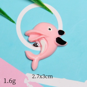 Detail view of pink resin dolphin charm showing 2.7x3cm dimensions and 1.6g weight