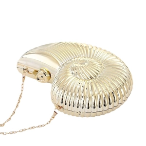 Elegant gold seashell clutch bag with metallic mirror finish and thin chain strap