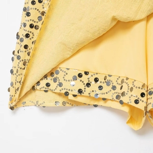 Western style sequin wrap mini skirt in vibrant yellow with gold and silver glitter detail
