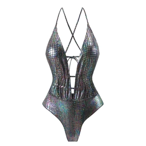 Detail of holographic metallic fabric with crocodile scale texture on deep V swimsuit
