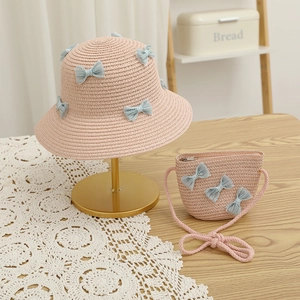 Pink straw sun hat and matching crossbody bag set with cute blue lace bows for girls