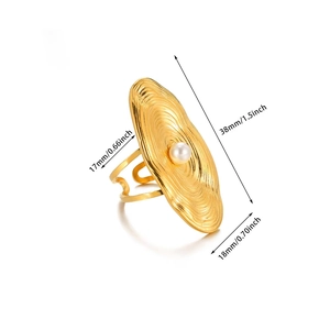 Detail shot of vintage gold textured ring with pearl and dimension markings
