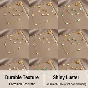 Detail view of nine gold stainless steel jewelry sets with hearts and evil eye motifs