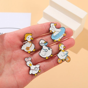 Five-piece cartoon duck enamel pin set featuring sports and medical themes for clothing