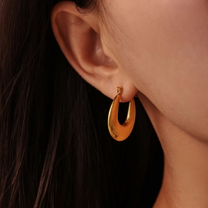 Minimalist U-shape gold hoop earrings for women, featuring a polished 18K gold-plated finish