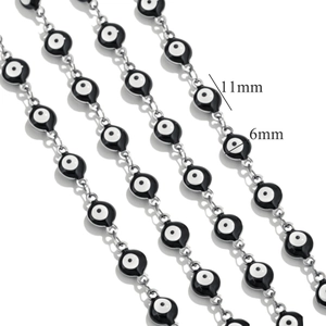 Detail view of 6mm evil eye beads on silver chain with 11mm spacing for DIY jewelry