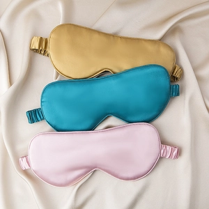Luxurious 22 momme mulberry silk sleep masks in gold, peacock blue, and pink colors