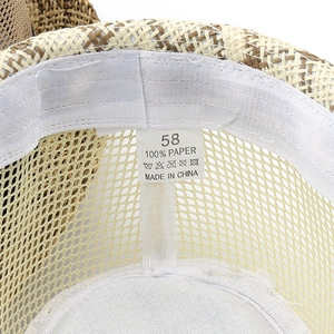 Macro detail of breathable 100% paper straw hat interior with size 58 label and sweatband