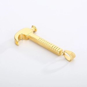 Close-up of golden hammer pendant with non-slip texture on high-quality stainless steel metal