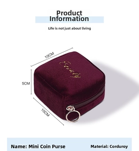 Detailed view of wine red corduroy mini lipstick bag with Beauty embroidery and gold zipper