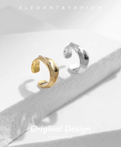 Detailed macro view of S925 sterling silver liquid metal ear cuffs in gold and silver