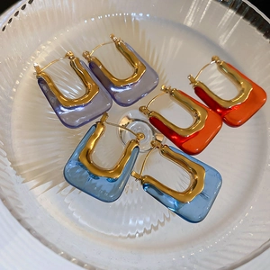 Vintage acrylic U-shaped earrings in purple, orange and blue with gold metal details