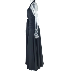 Detail view of the black halter dress featuring elegant side ruching and a high slit cut