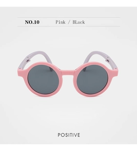 Front view of pink and purple foldable kids sunglasses with round frames and dark lenses