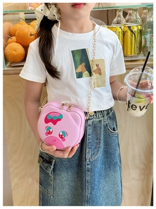 Detail of pink cartoon kids crossbody bag featuring gold metal chain and dual zippers