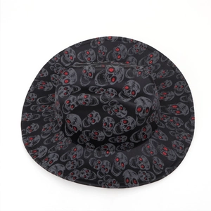 Top view of black cowboy hat with gray skulls and red sequin eyes for Halloween party