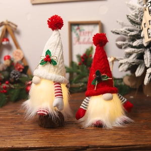 Set of two glowing Christmas gnomes with knit hats and warm LED lights for holiday decor