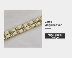 Macro view of the gold-tone metal chain intertwined with white leather for handbag strap
