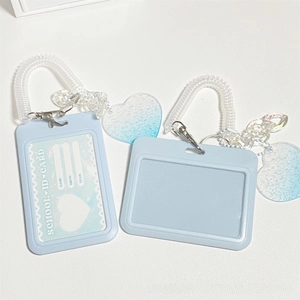Close-up of blue glitter heart student ID card holders with gradient cloud pendants