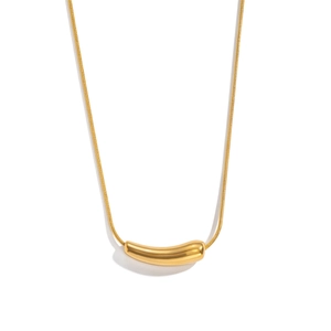 Detail of minimalist gold snake chain necklace with curved cylindrical polished pendant