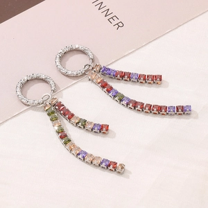 Detail of silver drop earrings with multi-colored square zircons and fringe chain design