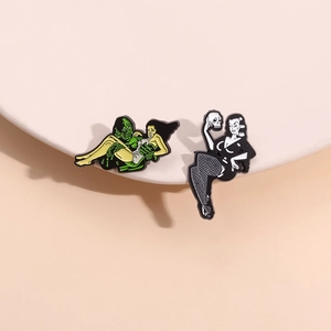 Gothic girl and monster skeleton enamel pins with retro pop art illustration style