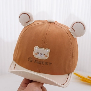 Close-up of baby baseball cap with bear ears, sweet embroidery and soft short brim
