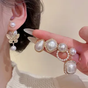 Elegant gold butterfly and pearl drop earrings set with crystals for women