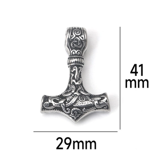 Detail shot of Thor's hammer pendant with Viking knot patterns, size 41mm by 29mm