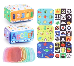 Detail of baby tissue box toy set with colorful sensory scarves and animal pattern fabric books