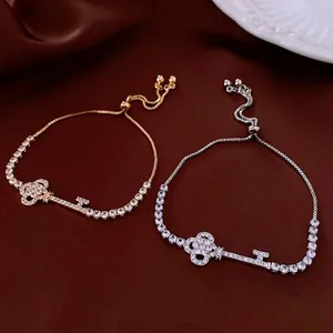 Zircon geometric key adjustable bracelet set in gold and silver finish on silk