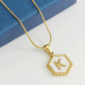 18k gold plated stainless steel hexagonal shell necklace with letter K pendant