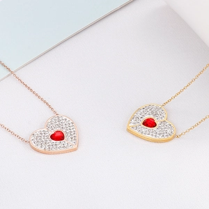 Sparkling heart pendant necklaces with red crystal and pavé rhinestones in gold and rose gold