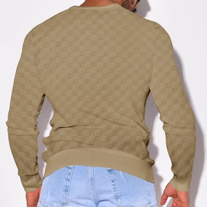 Macro shot of the beige checkerboard knit texture on men's casual long sleeve sweater