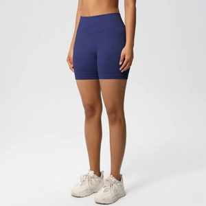Detail of high-waisted seamless navy blue fitness shorts with tummy control waistband