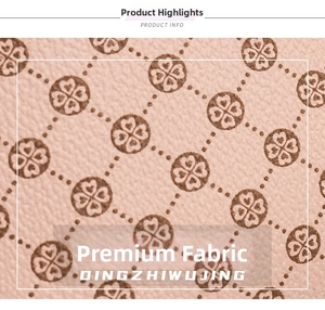 Macro shot of pink leather material with elegant brown floral pattern and grainy texture