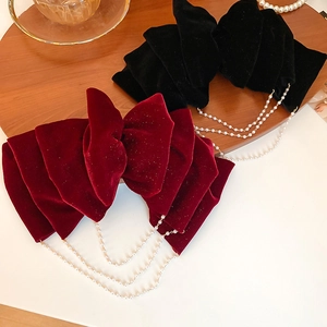 Elegant velvet bow hair clip with pearl tassels in burgundy and black options