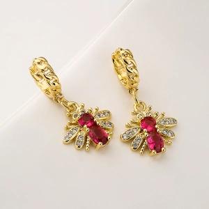 Gold plated bee drop earrings with red oval gemstones and sparkling zircon pavé