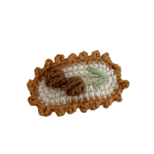 Handmade crochet flower hair clip with cream base and brown border for children