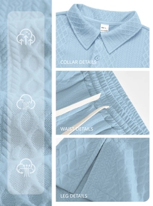 Detail view of light blue waffle knit texture, polo collar and drawstring waist details