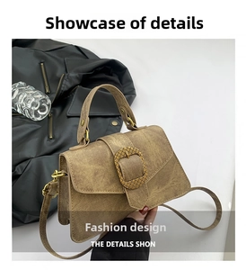 Macro view of vintage brown crossbody bag texture and square metal buckle closure