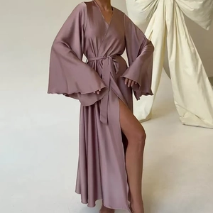 Detail of mauve satin robe featuring wide flare sleeves and elegant side slit design