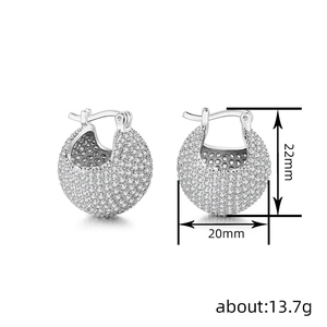 Silver thick hoop earrings paved with sparkling crystals and size dimension annotations