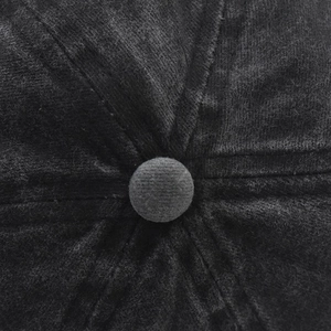 Macro view of black corduroy baseball cap top button and precision reinforced stitching